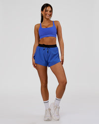 Woman wearing Accelerate 3" High-Rise Running Short - Black-Power Cobalt | Model:Bianca | Size:S | Thumbnail Index: 3