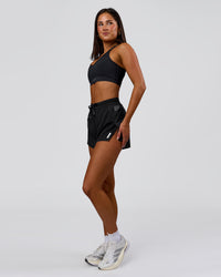 Woman wearing Accelerate 3" High-Rise Running Short - Black-Tech Department | Model:Bianca | Size:S | Thumbnail Index: 5