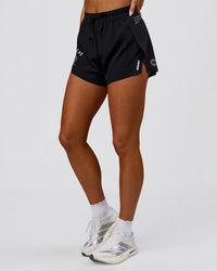 Woman wearing Accelerate 3" High-Rise Running Short - Black-Tech Department | Model:Bianca | Size:S | Thumbnail Index: 6