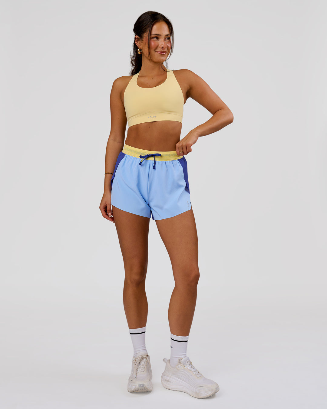 Woman wearing Accelerate 3" High-Rise Running Short - Power Cobalt-Open Air-Lemon | Model:Bianca | Size:S - view 4