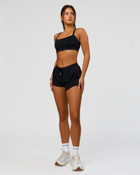 Woman wearing Accelerate 3" Mid-Rise Running Short - Black | Model:Bianca | Size:S
