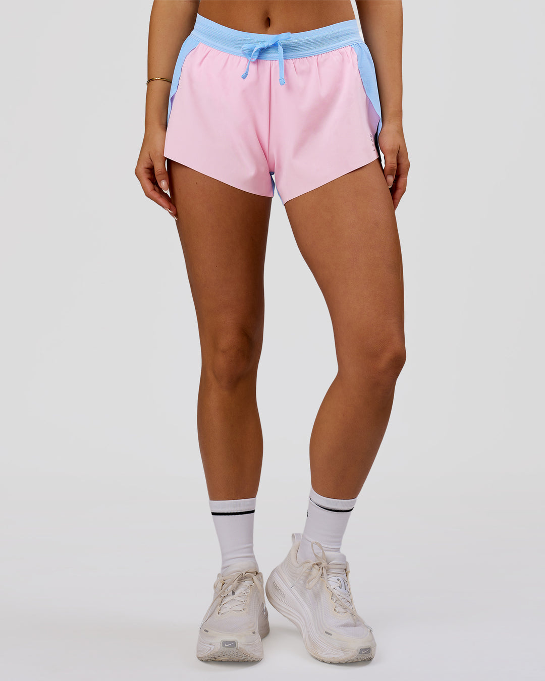 Woman wearing Accelerate 3" Mid-Rise Running Short - Open Air-Marshmallow | Model:Bianca | Size:S - view 2