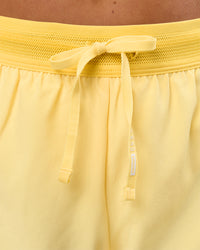 Woman wearing Accelerate 3" Mid-Rise Running Short - Sunbeam-Lemon | Model:Bianca | Size:S | Thumbnail Index: 8