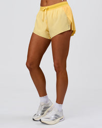 Woman wearing Accelerate 3" Mid-Rise Running Short - Sunbeam-Lemon | Model:Bianca | Size:S | Thumbnail Index: 12