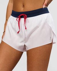 Woman wearing Accelerate 3" Mid-Rise Running Short - White-Future Navy | Model:Bianca | Size:S | Thumbnail Index: 1