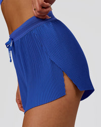 Woman wearing Accelerate 3" Pleated High-Rise Running Short - Power Cobalt | Model:Bianca | Size:S | Thumbnail Index: 6
