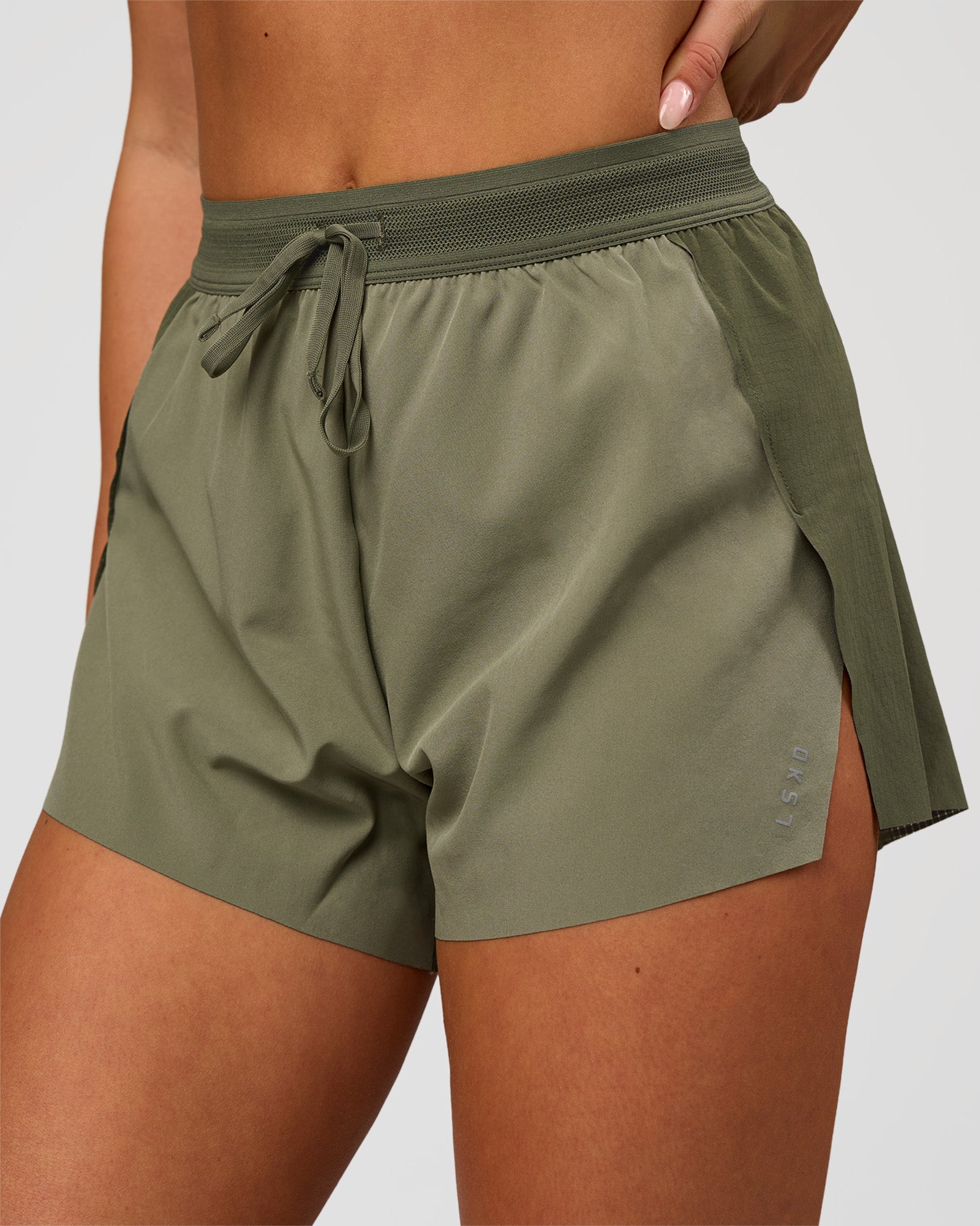 Woman wearing Accelerate 3" High-Rise Running Short - Pure Olive-Fog | Model:Bianca | Size:S