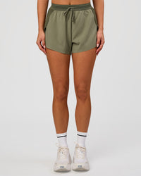 Woman wearing Accelerate 3" High-Rise Running Short - Pure Olive-Fog | Model:Bianca | Size:S | Thumbnail Index: 3