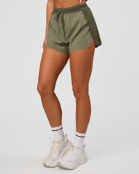 Woman wearing Accelerate 3" High-Rise Running Short - Pure Olive-Fog | Model:Bianca | Size:S | Thumbnail Index: 5