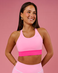 Woman wearing Accelerate Split Strap Sports Bra - Pink Rose-Ultra Pink | Model:Bianca | Size:S | Thumbnail Index: 0