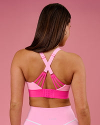 Woman wearing Accelerate Split Strap Sports Bra - Pink Rose-Ultra Pink | Model:Bianca | Size:S | Thumbnail Index: 1