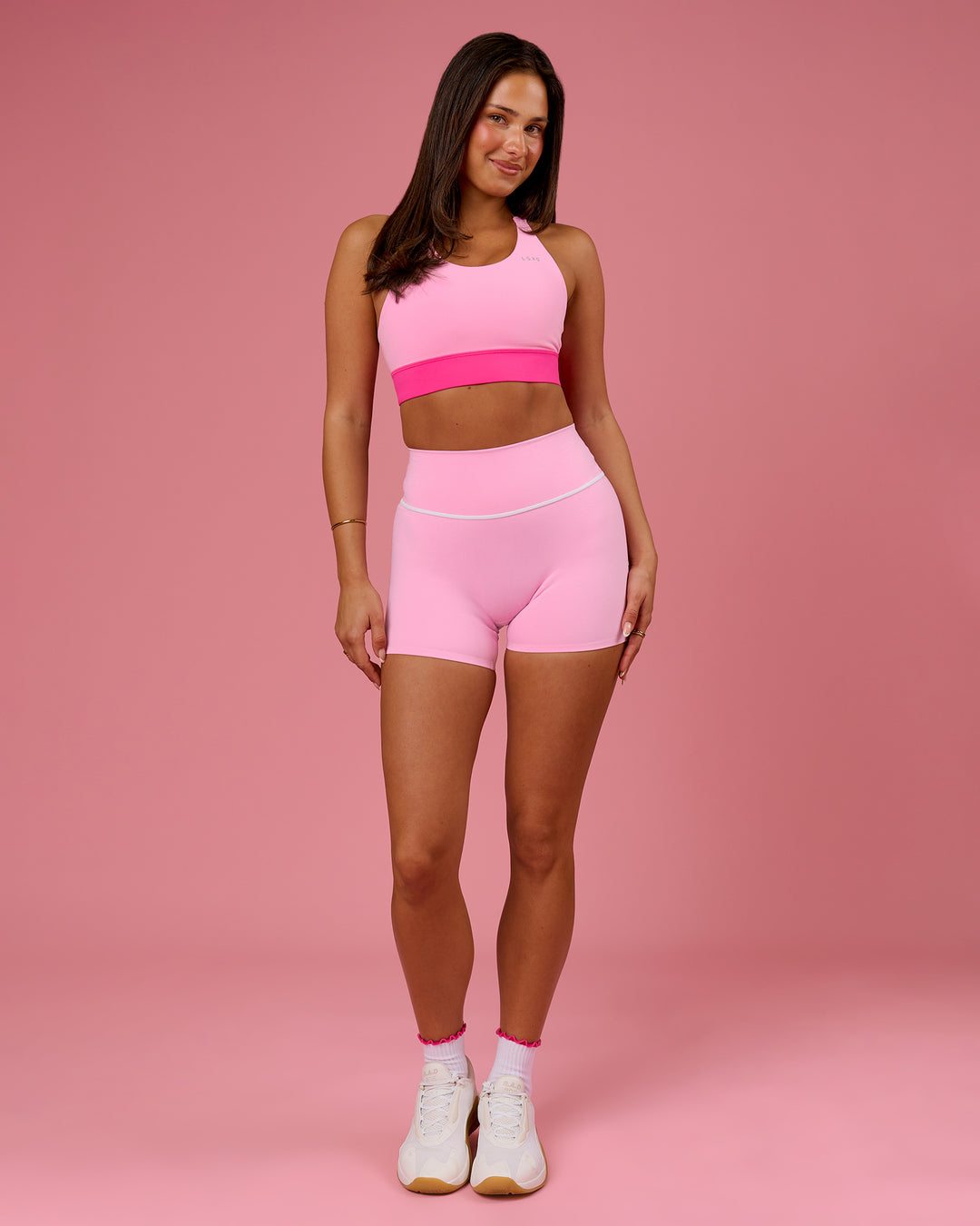 Woman wearing Accelerate Split Strap Sports Bra - Pink Rose-Ultra Pink | Model:Bianca | Size:S - view 6