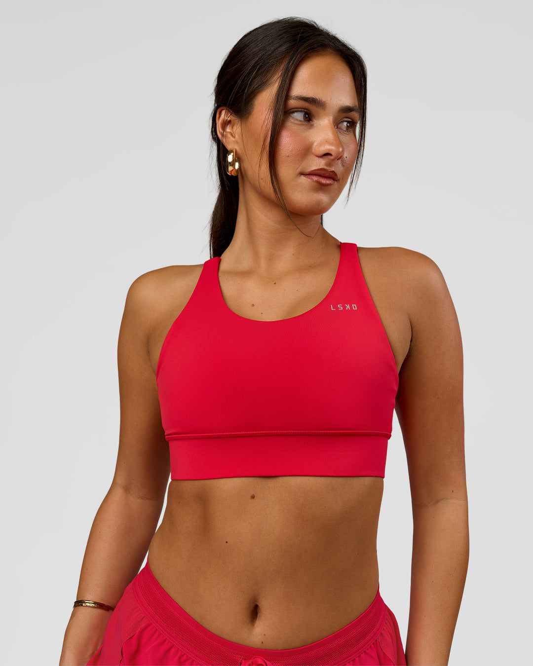 Woman wearing Accelerate Sports Bra - Scarlet | Model:Bianca | Size:S