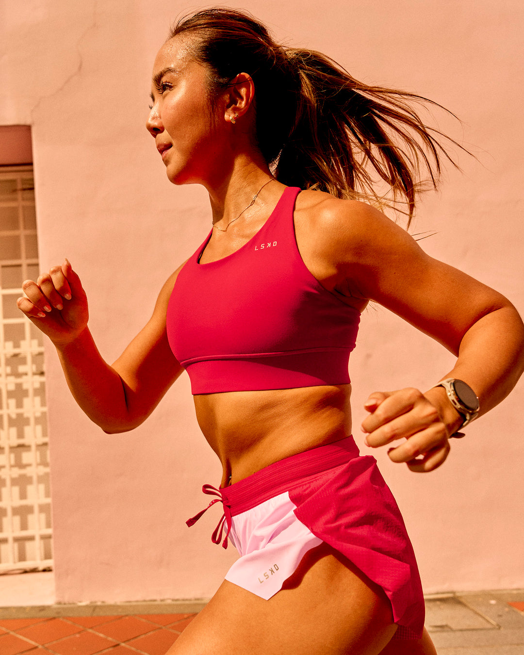 Woman wearing Accelerate Sports Bra - Scarlet | Model:Bianca | Size:S