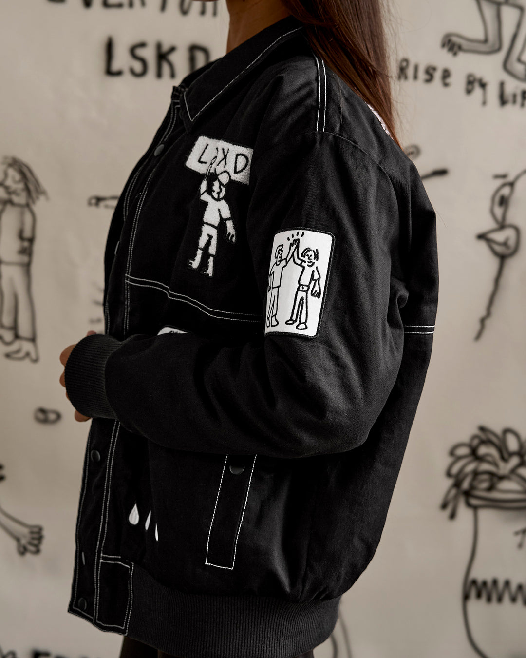 Woman wearing Andrew J. Steel x LSKD Bomber Jacket - Black | Model:Bianca | Size:S - view 23