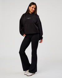Woman wearing Andrew J. Steel x LSKD Boxy Hoodie - Black | Model:Bianca | Size:S | Thumbnail Index: 7