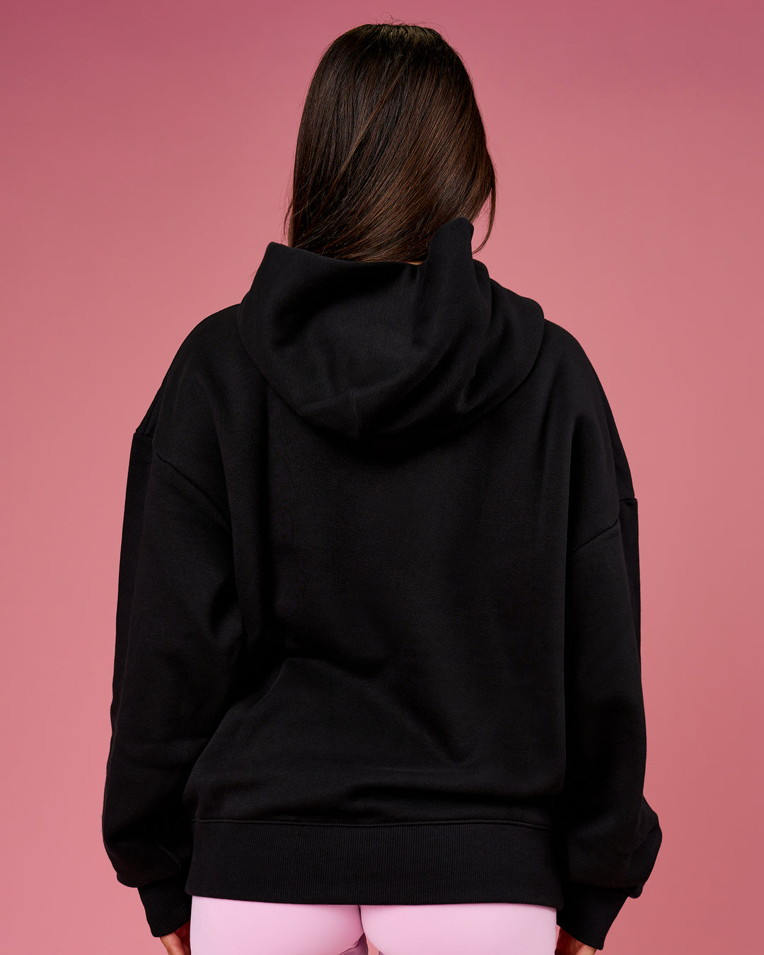 Woman wearing BCAM Unisex Oversized Hoodie - Black | Model:Bianca | Size:S - view 9