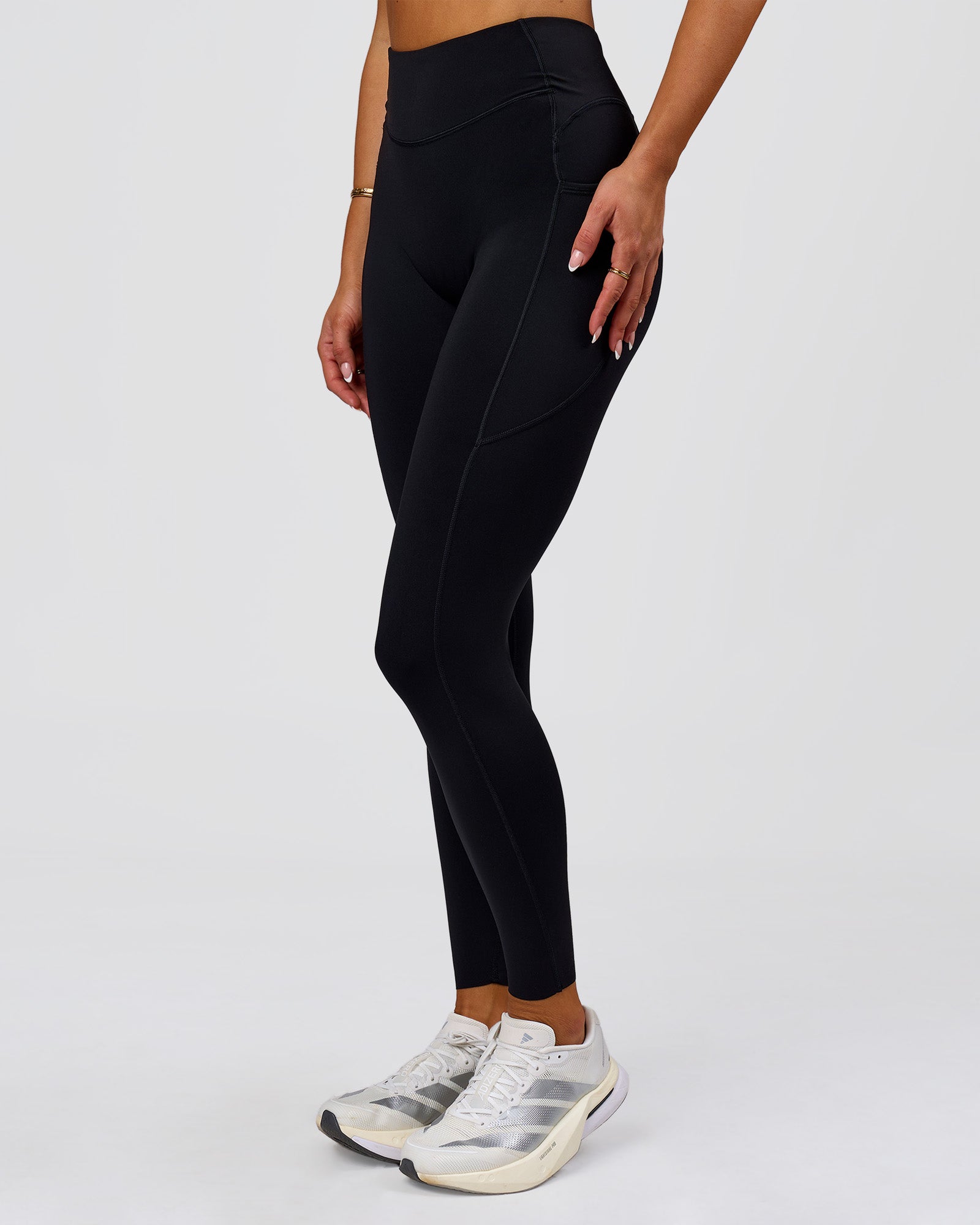 Woman wearing Elite Run High-Rise Full Length Legging Pockets - Black | Model:Bianca | Size:S