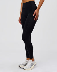 Woman wearing Elite Run High-Rise Full Length Legging Pockets - Black | Model:Bianca | Size:S | Thumbnail Index: 0