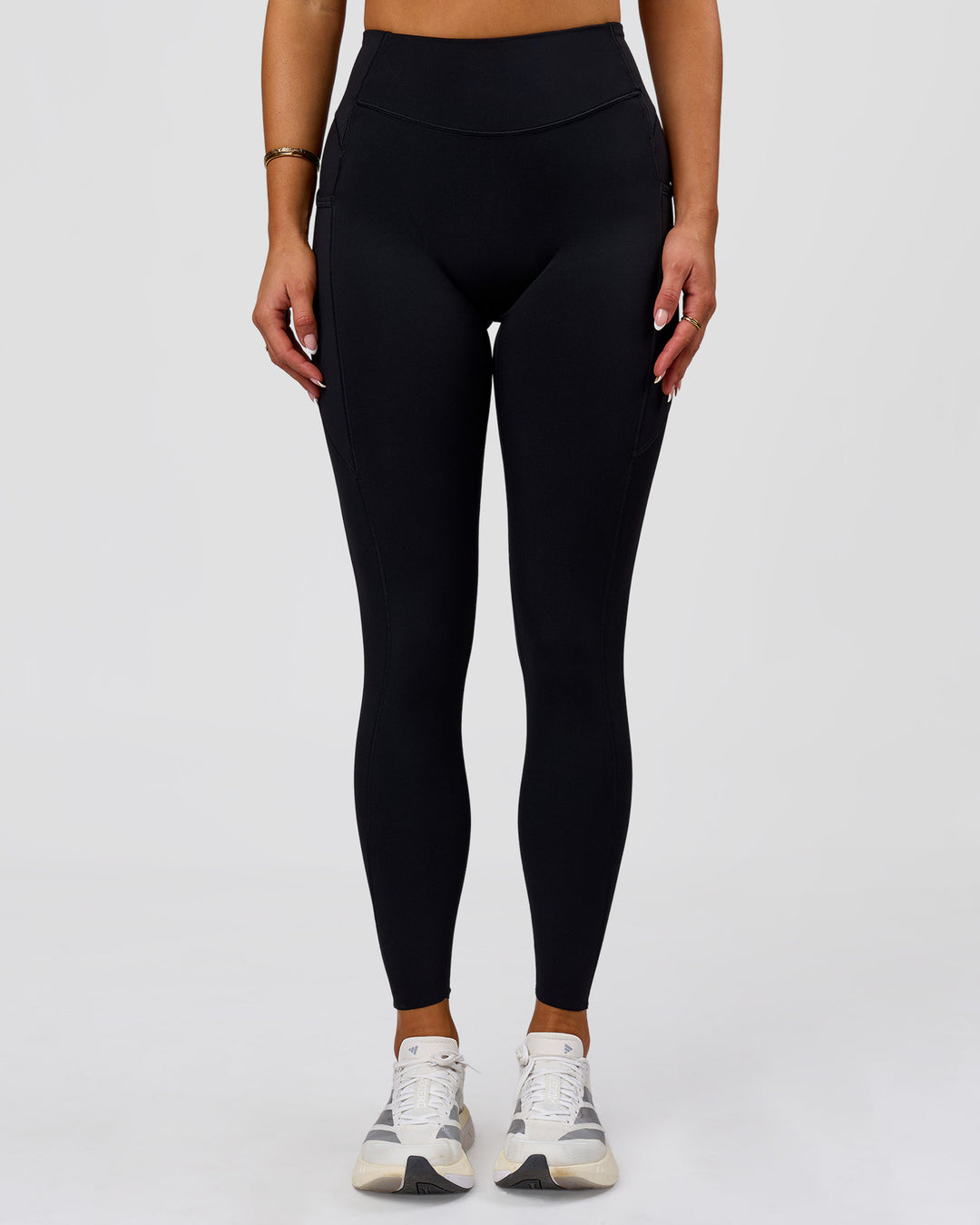 Woman wearing Elite Run High-Rise Full Length Legging Pockets - Black | Model:Bianca | Size:S - view 5