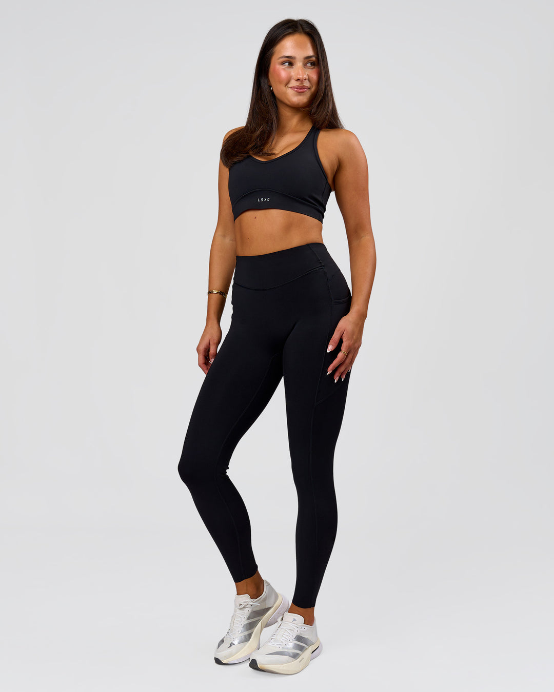 Woman wearing Elite Run High-Rise Full Length Legging Pockets - Black | Model:Bianca | Size:S - view 4