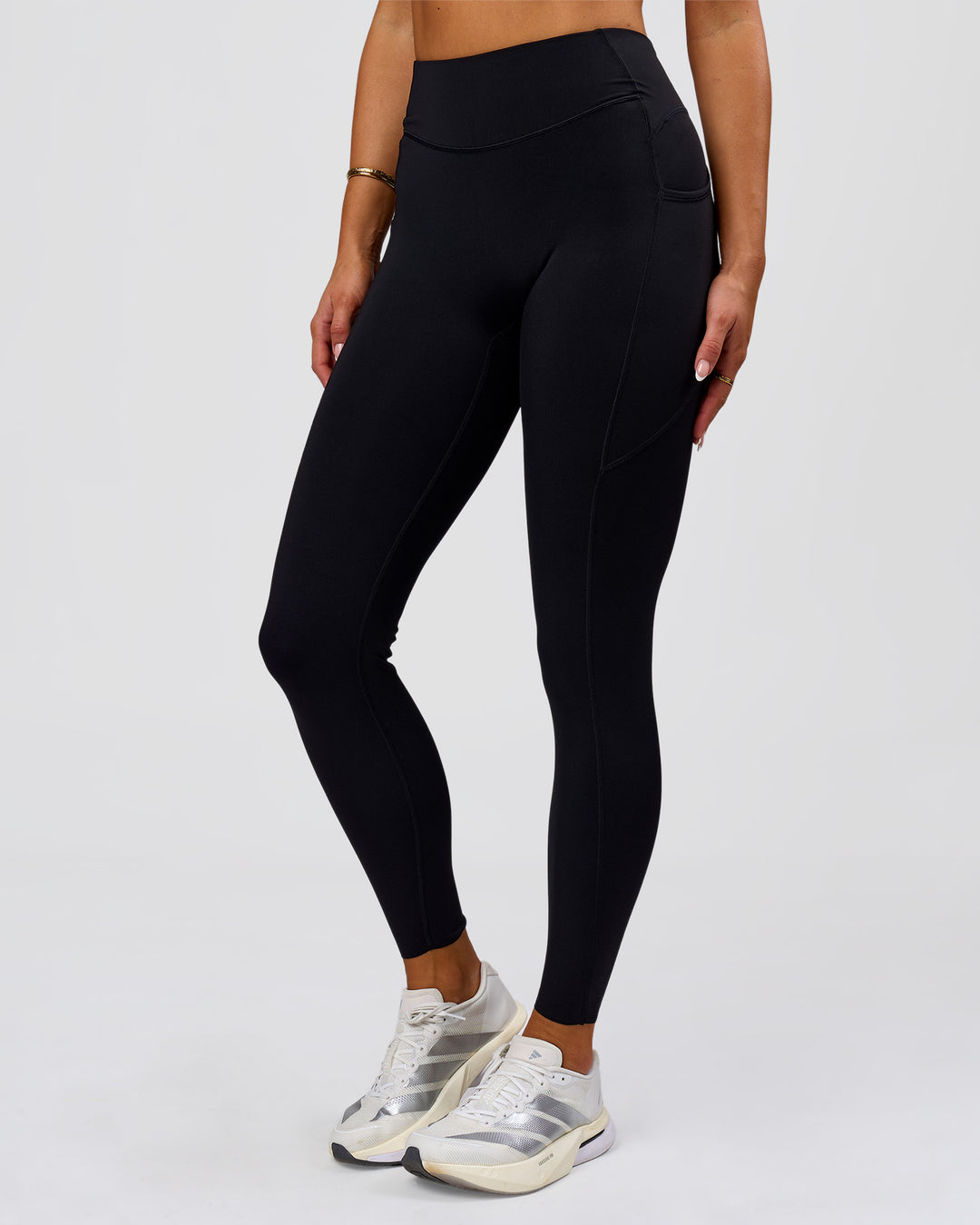 Woman wearing Elite Run High-Rise Full Length Legging Pockets - Black | Model:Bianca | Size:S - view 11