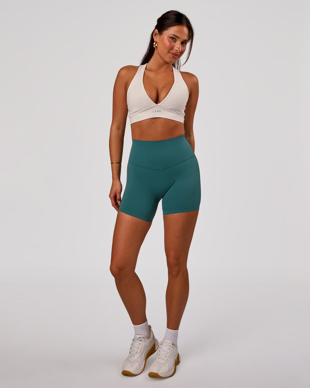 Woman wearing Elixir High-Rise 6” Short - Transformative Teal | Model:Bianca | Size:S - view 3