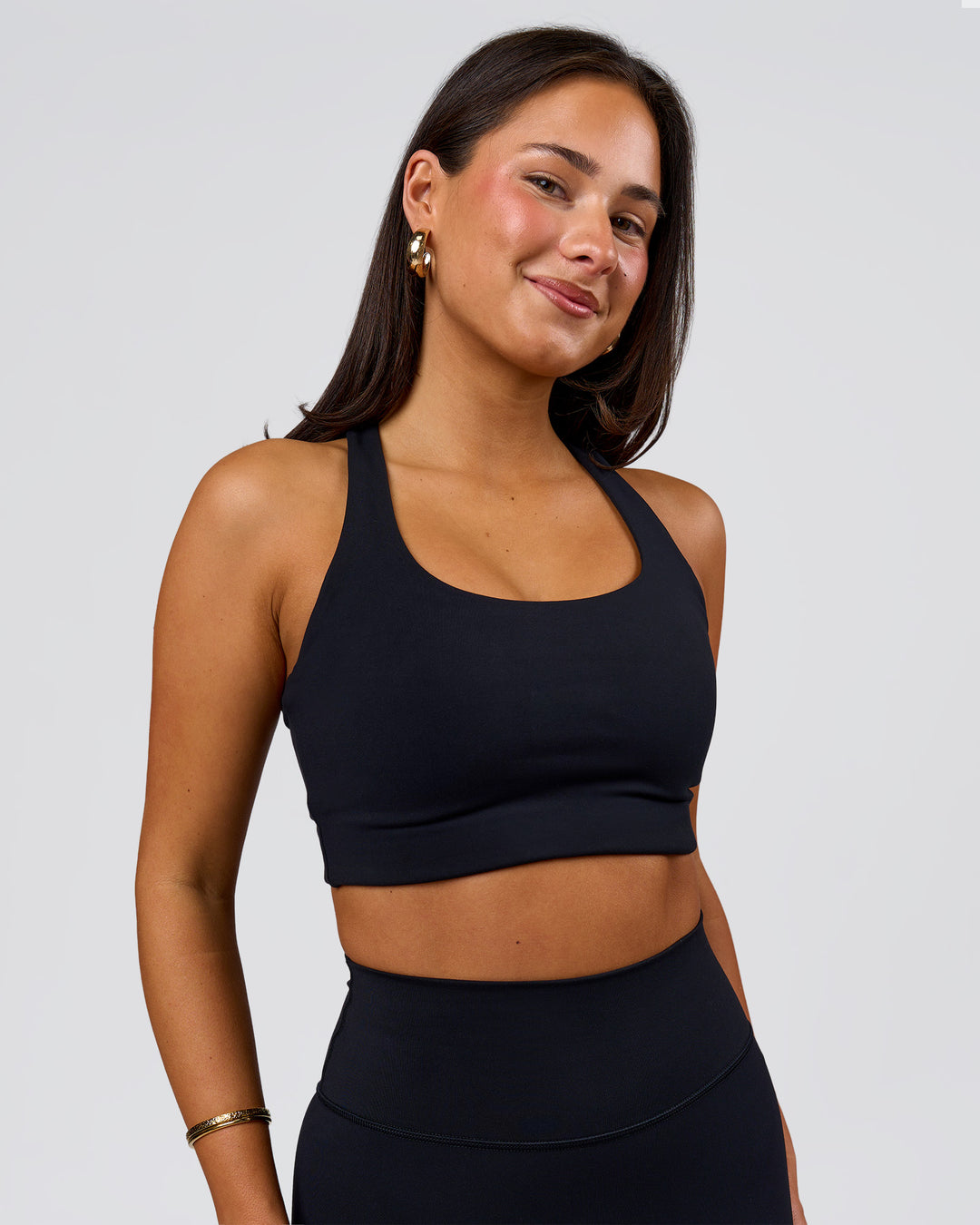 Woman wearing Flow Long Line Sports Bra - Black | Model:Bianca | Size:S - view 4