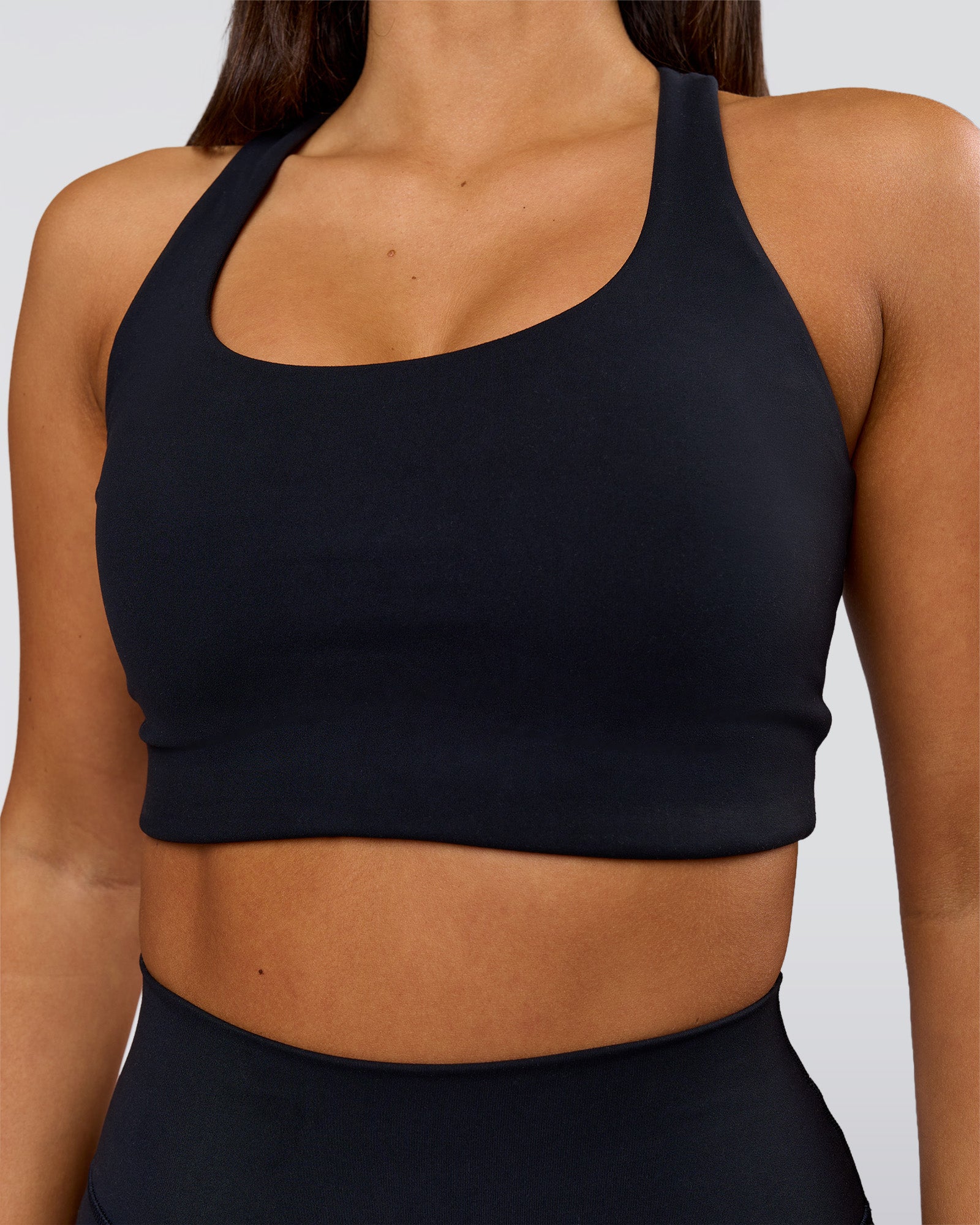 Woman wearing Flow Long Line Sports Bra - Black | Model:Bianca | Size:S