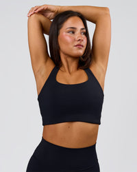 Woman wearing Flow Long Line Sports Bra - Black | Model:Bianca | Size:S | Thumbnail Index: 5