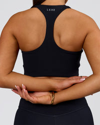 Woman wearing Flow Long Line Sports Bra - Black | Model:Bianca | Size:S | Thumbnail Index: 2