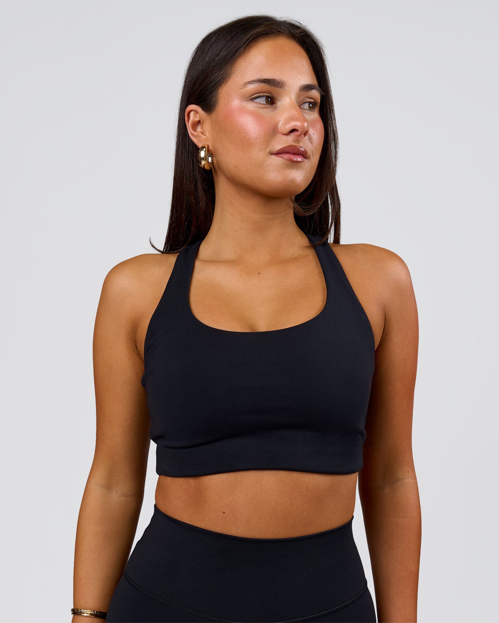 Woman wearing Flow Long Line Sports Bra - Black | Model:Bianca | Size:S