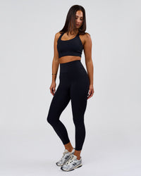 Woman wearing Flow Long Line Sports Bra - Black | Model:Bianca | Size:S | Thumbnail Index: 7