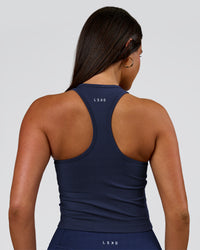 Woman wearing Flow Performance Shelf Bra Tank 2.0 - Future Navy | Model:Bianca | Size:S | Thumbnail Index: 2