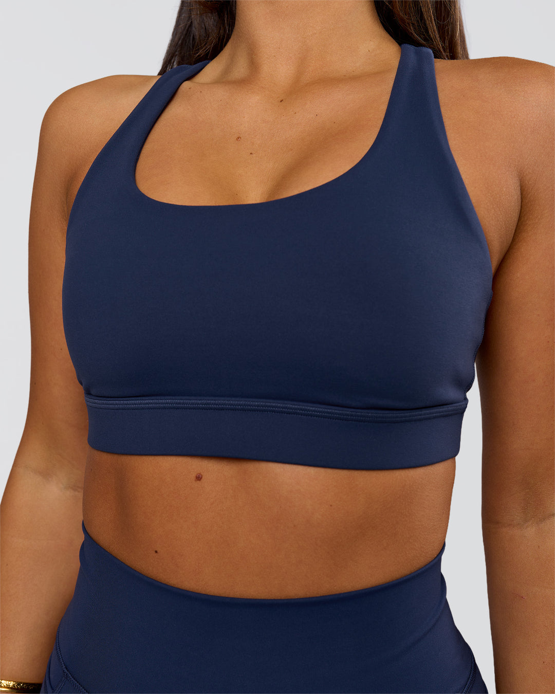 Woman wearing Flow Sports Bra - Future Navy | Model:Bianca | Size:S - view 2