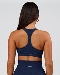Woman wearing Flow Sports Bra - Future Navy | Model:Bianca | Size:S | Thumbnail Index: 2