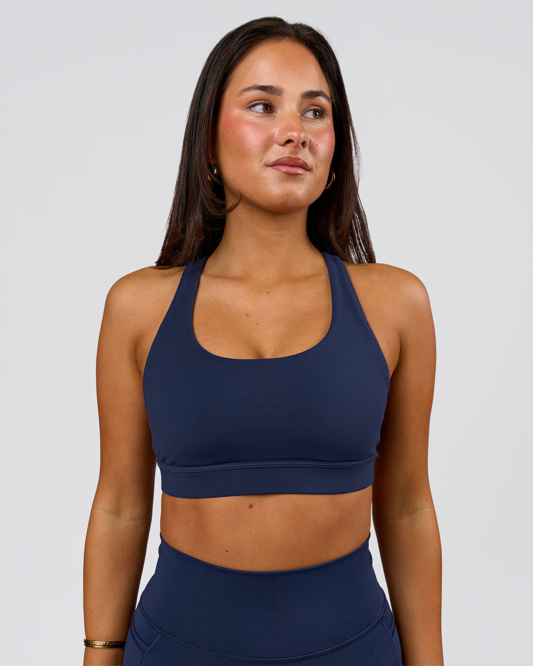 Woman wearing Flow Sports Bra - Future Navy | Model:Bianca | Size:S - view 1