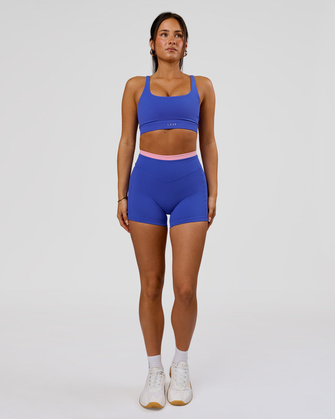 Woman wearing Fusion Contrast V-Waist High-Rise 4" Short Pockets - Power Cobalt-Pink Rose | Model:Bianca | Size:S - view 3