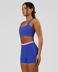 Woman wearing Fusion Contrast V-Waist High-Rise 4" Short Pockets - Power Cobalt-Pink Rose | Model:Bianca | Size:S | Thumbnail Index: 4