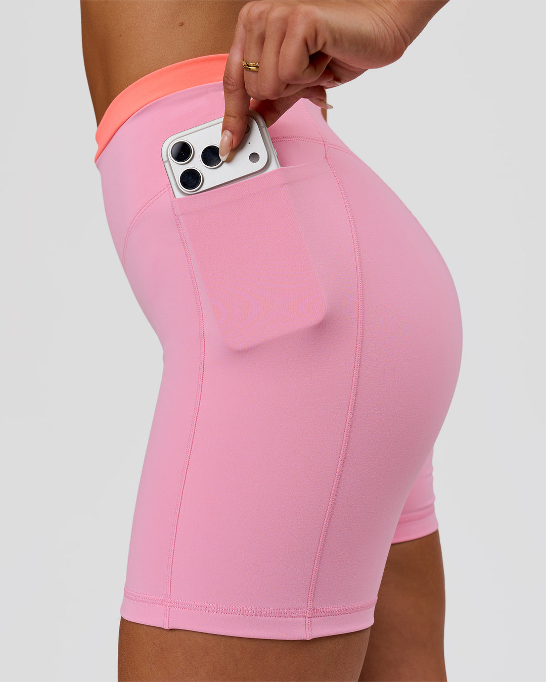 Woman wearing Fusion Contrast V-Waist High-Rise 6" Short Pockets - Pink Rose-Hyper Orange | Model:Bianca | Size:S - view 3