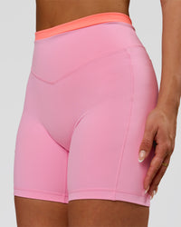 Woman wearing Fusion Contrast V-Waist High-Rise 6" Short Pockets - Pink Rose-Hyper Orange | Model:Bianca | Size:S | Thumbnail Index: 1