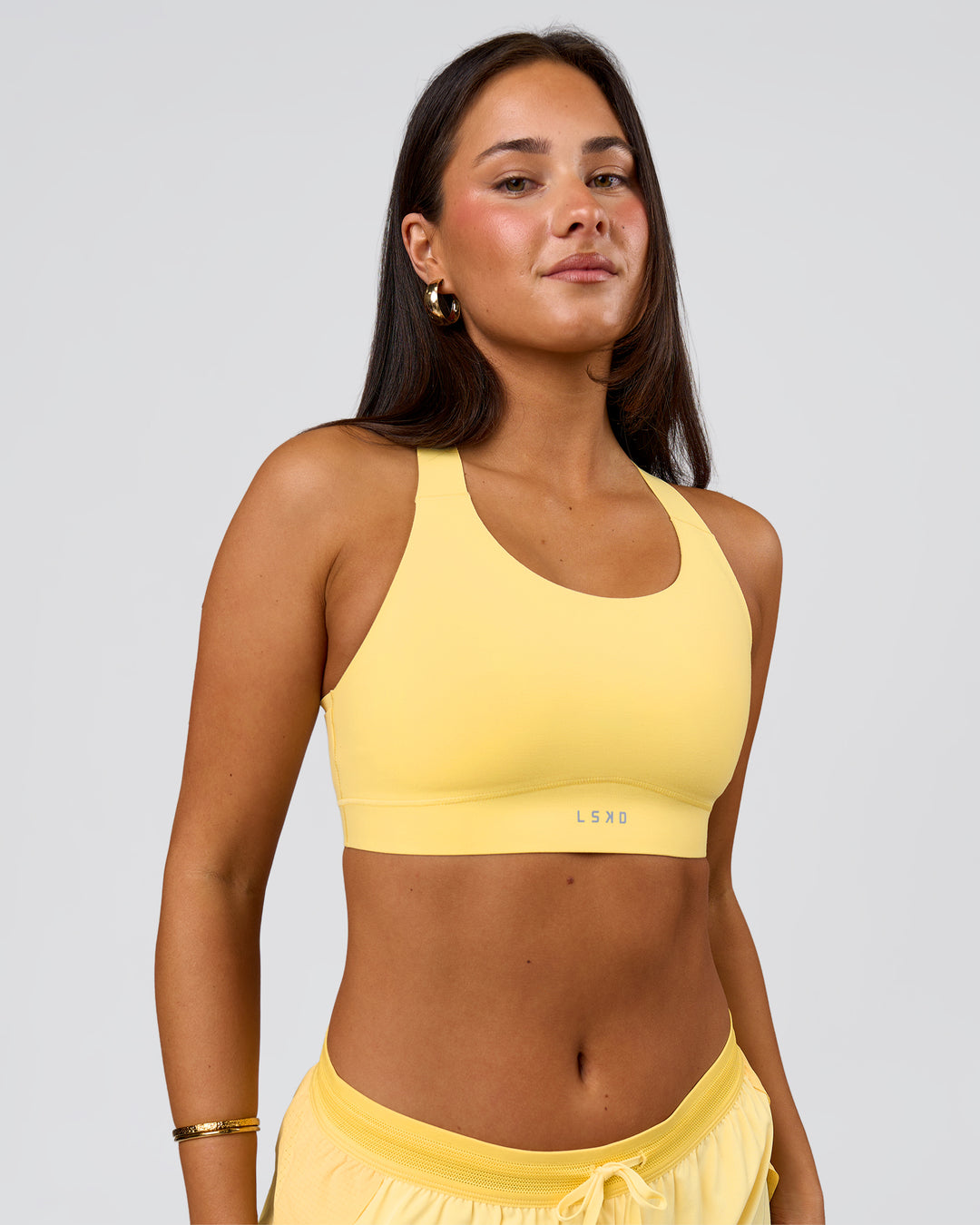 Woman wearing Fusion Sports Bra 2.0 - Lemon | Model:Bianca | Size:S - view 1