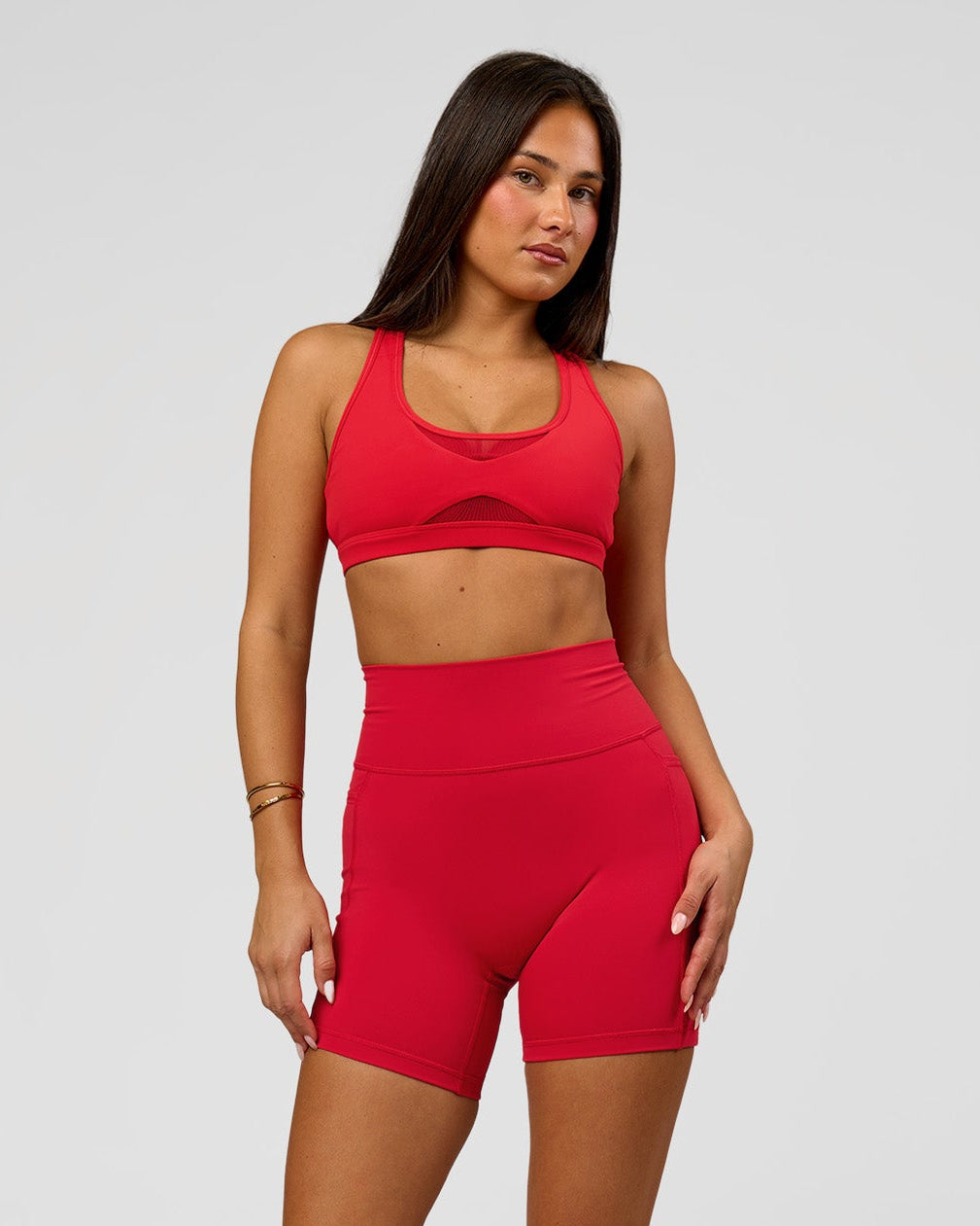 Woman wearing Fusion Ultra High-Rise 6" Short Pockets - Scarlet | Model:Bianca | Size:S
