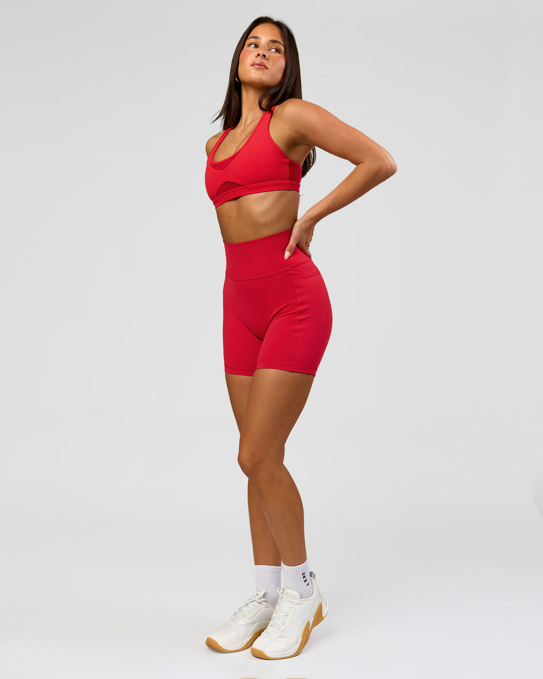 Woman wearing Fusion Ultra High-Rise 6" Short Pockets - Scarlet | Model:Bianca | Size:S - view 3