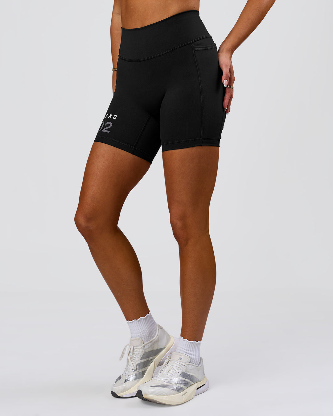 Woman wearing Fusion V-Contour High-Rise 6" Short Pockets - Black-Tech Department | Model:Bianca | Size:S - view 8