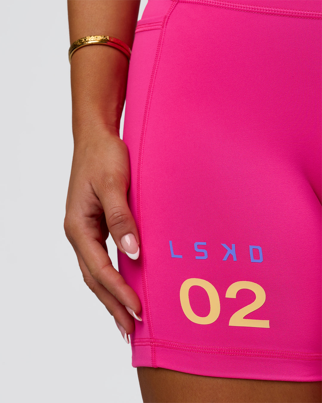 Woman wearing Fusion V-Contour High-Rise 6" Short Pockets - Ultra Pink-Tech Department | Model:Bianca | Size:S - view 8