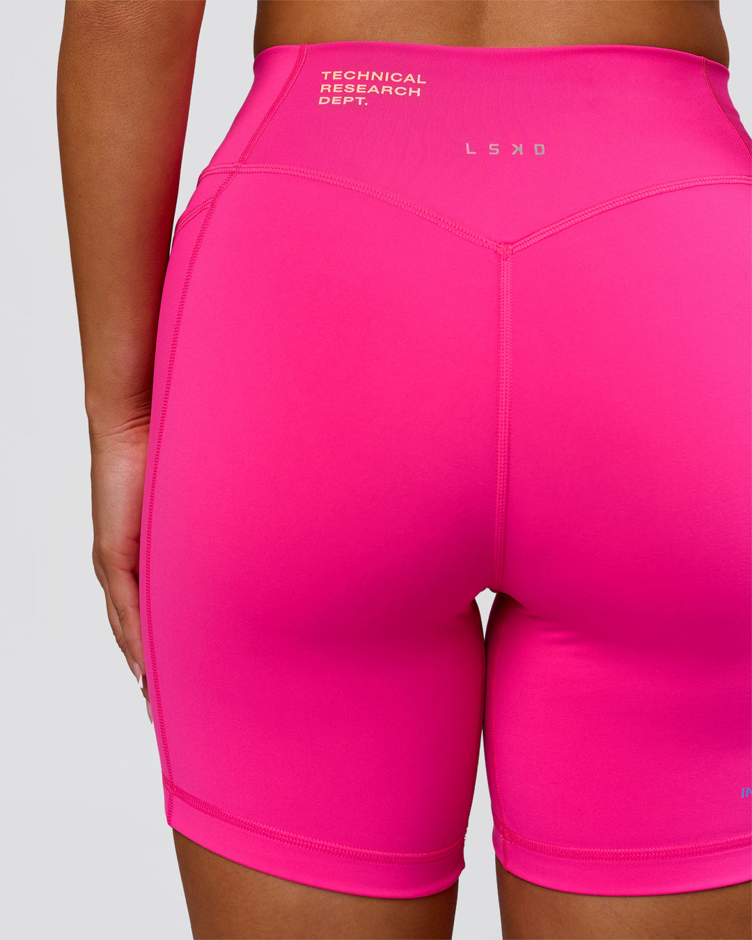 Woman wearing Fusion V-Contour High-Rise 6" Short Pockets - Ultra Pink-Tech Department | Model:Bianca | Size:S - view 9