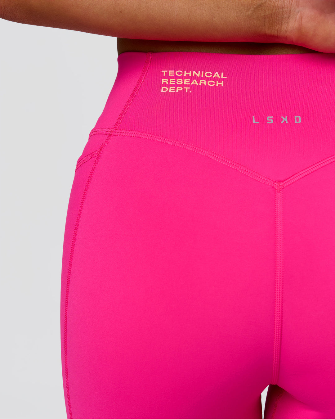 Woman wearing Fusion V-Contour High-Rise 6" Short Pockets - Ultra Pink-Tech Department | Model:Bianca | Size:S - view 14
