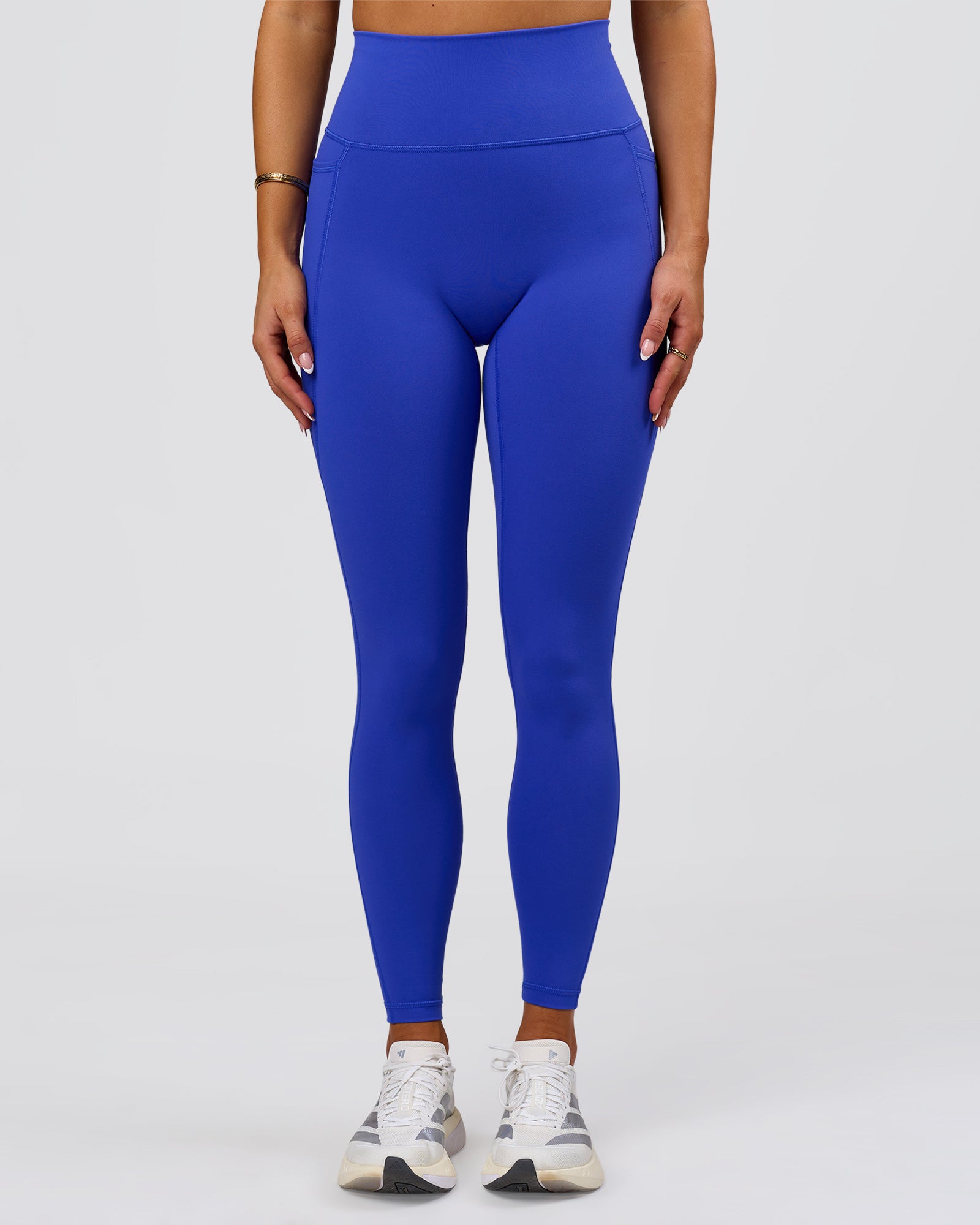 Woman wearing Fusion V-Contour Ultra High-Rise Full Length Legging Pockets - Power Cobalt | Model:Bianca | Size:S