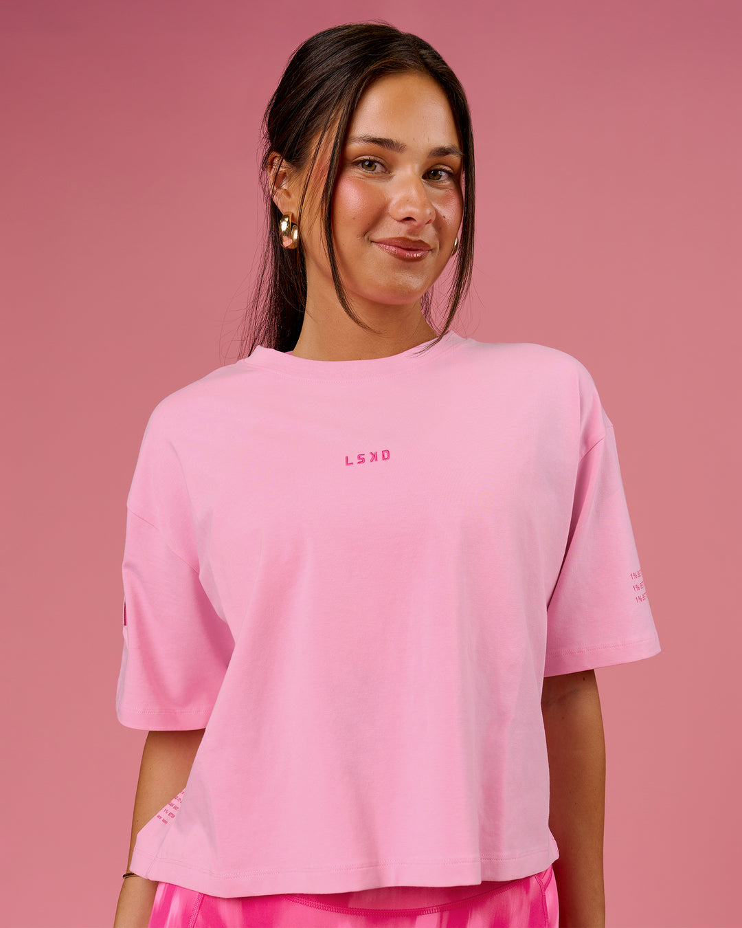 Woman wearing Go-To Heavyweight FLXCotton Graphic Skimmer Tee - Pink Rose-We Rise | Model:Bianca | Size:S - view 1